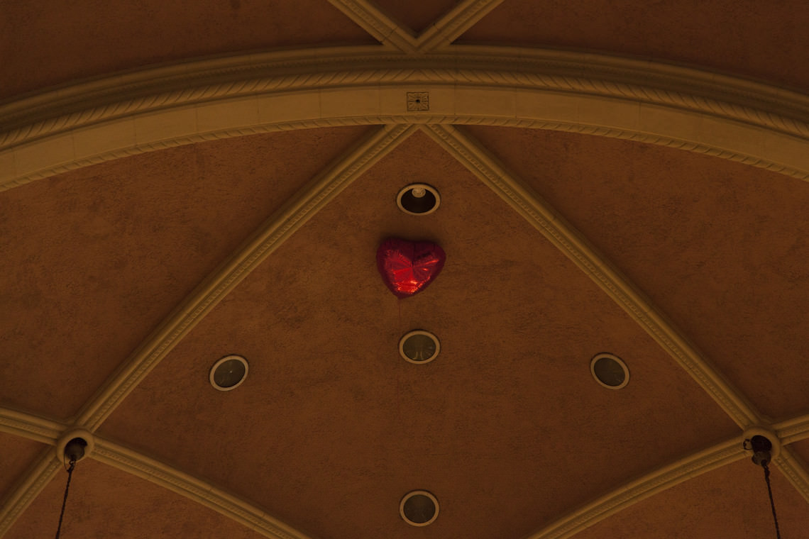  - untitled (a heart-shaped red balloon inflated with helium dropped into a church)